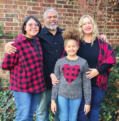 Julie Talton, far right, poses with her husband Byron and two daughters, Callie and Savannah. Photo provided.