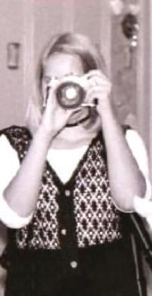 Julie (Duff) Talton takes pictures for the yearbook at Shawnee High School, as someone gets her picture. Photo provided.