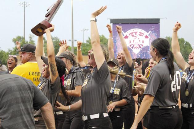 Tecumseh senior Serenity Jacoway lifts the Class 5A Slow Pitch State Championship trophy up for the families and fans to see, as her teammates cheer, following their victory in the finals against Washington on April 30. This is the first softball state win for Tecumseh. They had a state basketball win in 1993, and two academic bowl wins in 1997 and 1998, according to the OSSAA website. Countywide &amp; Sun/Natasha Dunagan