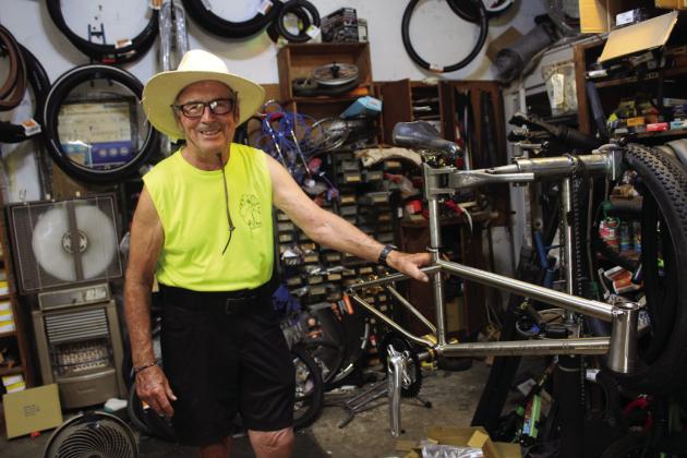 Larry Smith, owner of The Bicycle Shoppe in Shawnee, poses by the bicycle he designed in memory of BMX racer Rodney Cooper for Cooper’s sister Cindy Parsons. Cooper and Parsons will be inducted into the Oklahoma BMX Hall of Fame, in Tulsa, on Oct. 12. Smith was inducted in 2022 in the Industry category. Countywide &amp; Sun/Natasha Dunagan