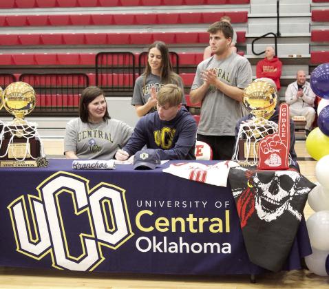 Levi Kelly signed a letter of intent with the University of Central Oklahoma in Edmond for basketball during Dale Signing Day on Nov. 14. Also show, from left, are mom, Angie Kelly; sister-in-law, Macie Kelly; and, brother, Luke Kelly.