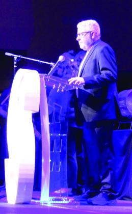 C3 Cross Connection Church Pastor Ken Kerbo leads the invocation at the Shawnee Police Foundation Annual Banquet on Jan. 30. Kerbo's church offered a warming center for the homeless and those without heat in their homes during below-freezing temperatures last week. Natasha Dunagan, Countywide &amp; Sun