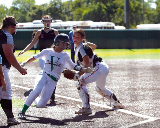 Earlsboro catcher Lilly Gentry tries to tag a Varnum runner before they reach home during the third inning of the Aug. 17 Varnum game. The Lady Wildcats won against Varnum, 8-4, at the Little River Conference Fast-Pitch Tournament. On Aug. 15, they beat Paden, 13-1, and lost to Strother, 2-9. They won over Sasakwa, 16-1, on Aug. 16, and they lost to Macomb, 3-8, on Aug. 17.