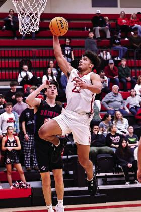 North Rock Creek’s Caleb Hawkins goes up for two.