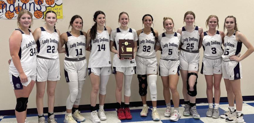 The Asher Lady Indians pose with their District Championship plaque after beating Legacy Christian 45-14 in the finals on Saturday, Feb. 10. Photo provided