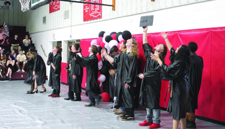 The Macomb High School Class of 2023 toss their caps after the Commencement Ceremony on May 6. They had 14 graduates this year.