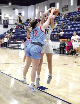 SHS senior, Josie Megehee gets fouled in the fourth quarter as she shoots for two.