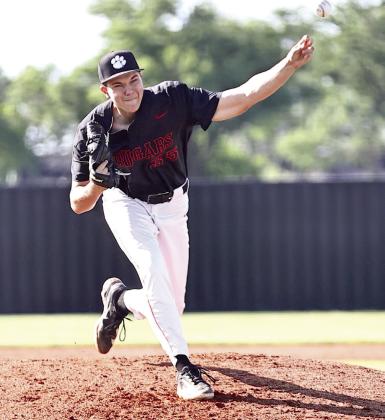North Rock Creek's senior Cason Coomer hurls the ball across home plate. Photo courtesy of Gowin Photography