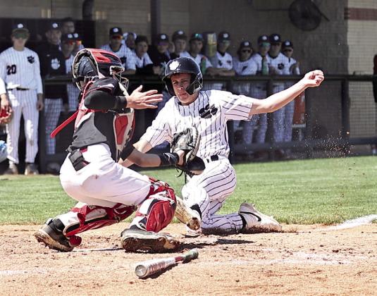North Rock Creek's Jaxson Loftis is safe at the home in action Friday, May 2 against Muldrow. NRC won the Regional Championship, defeating Muldrow 10-0 on Friday, then beating Victory Christian on Saturday 3-2, and Sunday 8-1. Photo courtesy of Gowin Photography