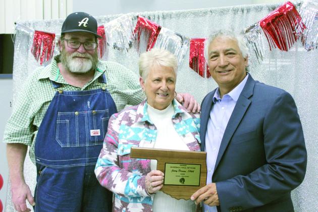 The son and wife of Jerry Dixson - Darin Dixson and Shirley Dixson - accept the Asher Baseball Booster Club Hall of Fame plaque from Head Baseball Coach David Rolette. Natasha Dunagan, Countywide &amp; Sun