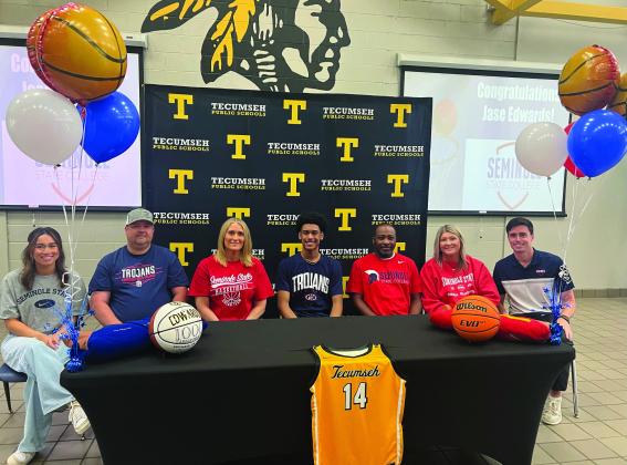 Tecumseh senior Jase Edwards signed a letter of intent in basketball for Seminole State College on May 6. Shown, from left, is Jayden Edwards, sister; Joe Hooser, stepfather; Sarah Hooser, mother; Edwards; Tecumseh Head Boys Basketball Coach Bryant Edwards, father; Michelle Edwards, stepmother; and Lucas Hunter, SSC head coach. Photo provided.