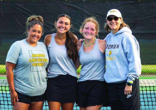 Tecumseh Assistant Tennis Coach Megan Laughlin, #1 Doubles Team Jalee Meyers and Laycee Thoma, and Head Tennis Coach Jennifer McKnight pose at the Class 4A Girls State Tennis Tournament on May 4 at the OKC Tennis Center. They placed seventh out of the state. Photo provided.