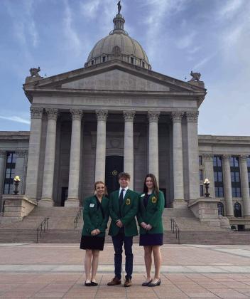 Kimberly Holland and Taylor Marrs, both of Tecumseh, and Grace Hobbs, of North Rock Creek, pause for a photo in front of the Oklahoma State Capitol for the 25th Annual 4-H Day on April 17. Photo provided.