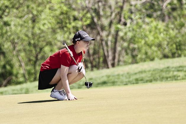 North Rock Creek's Kimber Chesser eyes the pin. She shot a personal best of 84. Photo courtesy of Gowin Photography