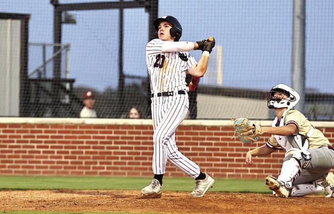 North Rock Creek's Hunter Bertram watches the ball soar for a grand slam home run. Photo courtesy of Gowin Photography
