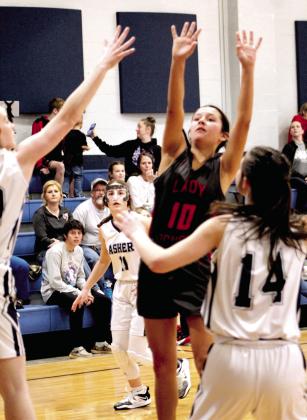 Macomb’s Aubree Akens tries for a basket in the third quarter of the game at Asher on Jan. 28. The Asher Lady Indians won, 47-15. Countywide &amp;amp; Sun/Natasha Dunagan