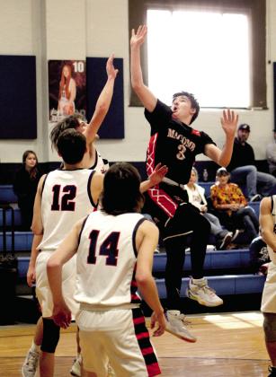 Macomb’s Radlee Blaine tries for a bucket in the first quarter of the game at Asher on Jan. 28. The Asher Indians won, 50-14.Countywide &amp; Sun/Natasha Dunagan