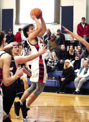 Asher’s Garrett Leba makes a jump shot at the end of the second quarter in the home game against Macomb on Jan. 28. The Asher Indians won, 50-14. Countywide &amp; Sun/Natasha Dunagan
