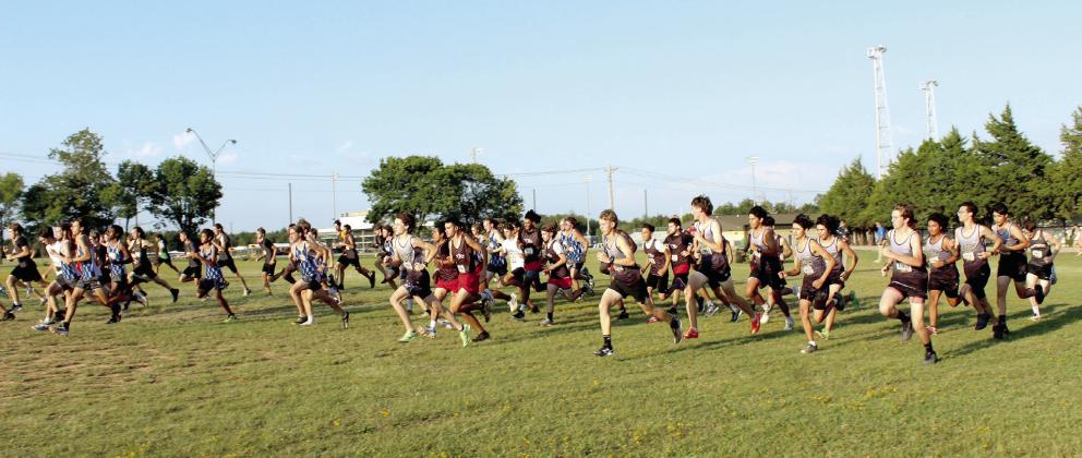 The high school boys take off from the starting line during the 2025 Savage Cross Country Invitational on Sept. 23. There were 77 high school boys who completed the race. See full caption below.
