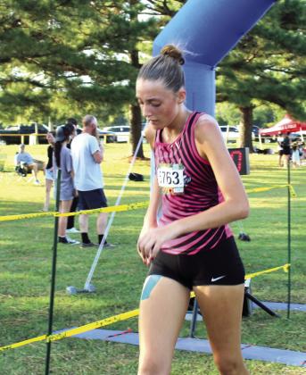 Tecumseh sophomore Emma Rodgers crosses the finish line in 20th place out of 49 high school girls. Natasha Dunagan, Countywide &amp; Sun