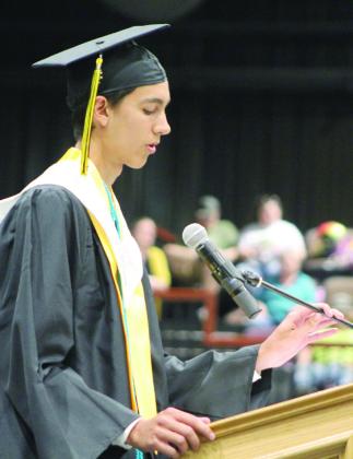 Tecumseh Co-Valedictorian Logan Haworth talks to his classmates during the THS Commencement Ceremony on May 17 at FireLake Arena. Countywide &amp;amp; Sun/Natasha Dunagan