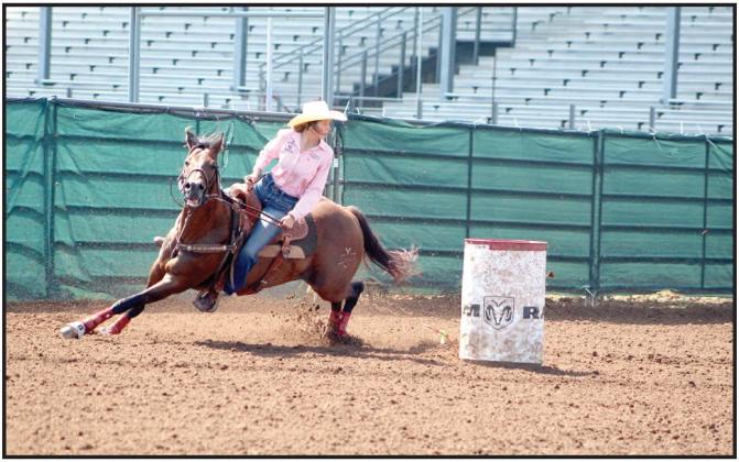 Bella Branham of Tecumseh competes in the second round of barrel racing at the IFYR on July 13. Countywide &amp; Sun/Natasha Dunagan
