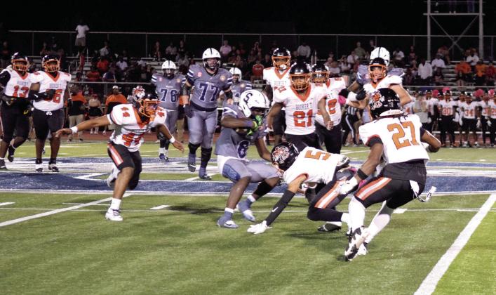 . Ke'Darrius Palmer fights his way through the Booker T. Washington defense.