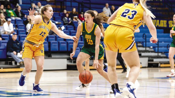 Bethel graduate and now OBU Freshman, Parker Stevenson, drives between two Southeastern defenders. The freshman guard Parker Stevenson was tabbed as Great American Conference Co-Player of the Week on Monday, after leading the Bison to a 56-54 comeback win at Southeastern Oklahoma State over the weekend.