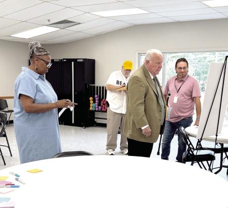 Darlene Richardson (far left) and Rocky Barrett give their opinion on what they prefer to see at Farrall Park, while Butch Lutomski and Ward 3 Commissioner Chris Odneal look on, at the morning session of the Farrall Park Vision meeting held on Aug. 6. Another meeting was held that evening at 7 pm.