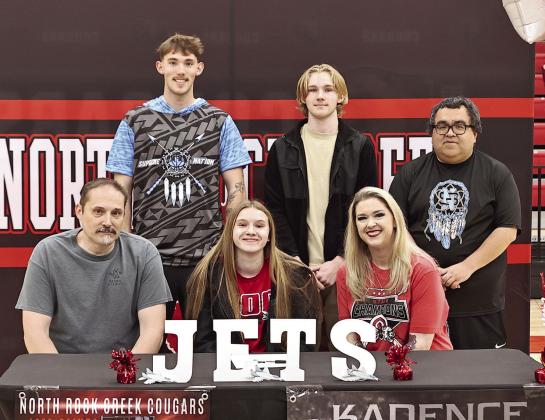 Kadence Munn signs her letter of intent for Northern Oklahoma College between her parents Chad and Mariah, while brothers Maddox &amp; Tristen, along with her club coach Jesse Bustos, look on. Photo Courtesy of Gowin Photography.