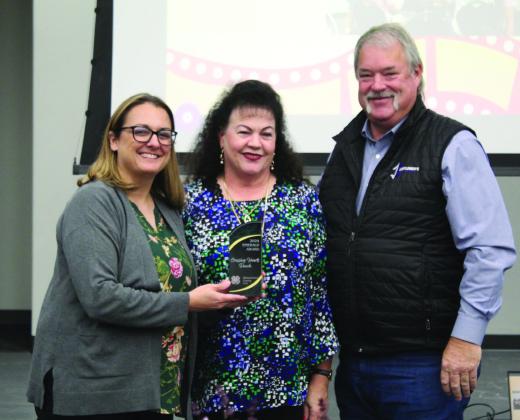 Pottawatomie County 4-H Club Educator Kacie Jasper presents the Emerald Award to Suzanne and Randy Gilbert at the P.C. 4-H Club Awards Banquet, held at North Rock Creek High School on Oct. 21. Countywide &amp;amp; Sun/Natasha Dunagan