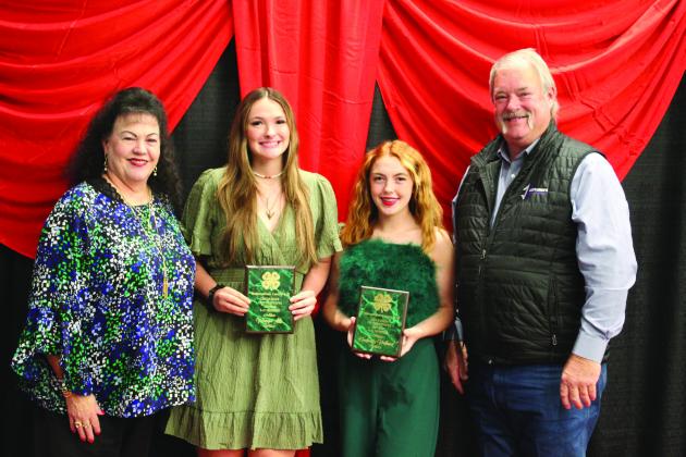 Suzanne and Randy Gilbert presented the Outstanding Senior Award to Megyn Alls and Kimberly Holland during the Pottawatomie County 4-H Awards Banquet, held at North Rock Creek High School on Oct. 21. Countywide &amp;amp; Sun/Natasha Dunagan