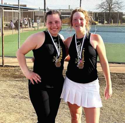 Tecumseh High School tennis players Karsyn McDonald and Jaycee Thoma pose at the OBU tennis courts after winning third place in 2 Doubles during the Shawnee Invitational on March 10. Photo provided.