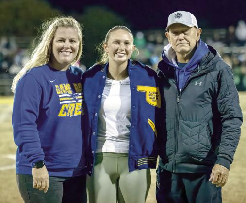 Kloee Nichols received her All-State Golf jacket during the last football game of the season, Friday, Nov. 3. Nichols is currently attending Oklahoma Baptist University and is on its golf team. Pictured from left, Jennifer Lynch-Athletic Director, Nichols, and Coach Tommy Block.