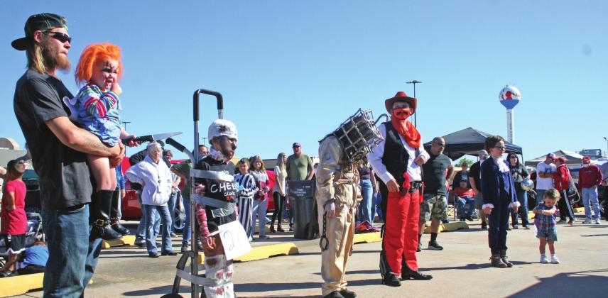 The six winners of each costume contest category line up awaiting the judge’s decision for the Grand Prize winning costume, during the 17th Annual FireLake Casino Car Show, Saturday afternoon, Oct. 16. Countywide &amp;amp; Sun/Kendra Johnson