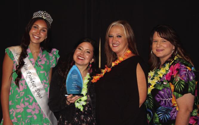 Kyia Robison, second from left, and Tiffany Truelove, accept the Business of the Year Award for Legacy Parenting Center during the Tecumseh Chamber of Commerce Annual Meeting &amp; Awards Banquet on Nov. 21. Also shown are Miss Frontier Days Jalee Meyers, far left, and current Farmer’s Daughter Market owner, Kendra Sullivan. Farmer’s Daughter received the award last year. Countywide &amp; Sun/Natasha Dunagan