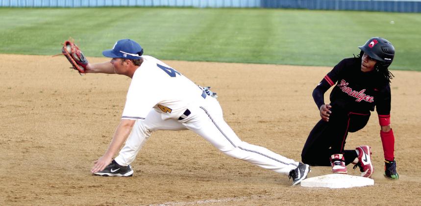 Bethel junior Cayden Carpenter lunges for the catch at first.