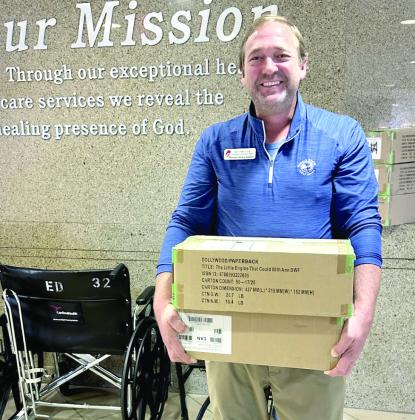 The Pioneer Library System Foundation donated another 1,000 Dolly Parton Imagination Library books to SSM Shawnee!! Pictured is Will Merrick, PLSF Development Officer, “This delivery represents what’s best about our community — people coming together to make sure every child has the chance to dream big, learn early, and grow strong.” Photo Provided