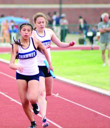 Gracyn Simpson hands the baton off to Aniya Kowena during a relay race at the OBU Invite on April 4. Countywide &amp; Sun/Natasha Dunagan