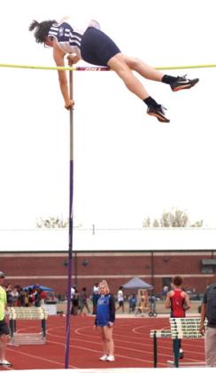 Shawnee’s Traydn Rakestraw participates in the pole vaulting event.