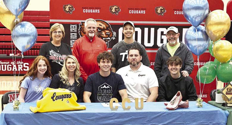 North Rock Creek's Ethan Nowakowski signs his letter of intent to run track at Colorado Christian University. Sitting is Jannah Shoffner, parents Brandi &amp;amp; Chris and brother Zach. Standing Melanie McLaughlin, Burky Curtis, Tyree York, and Pete Nowakowski. Photo courtesy of Gowin Photography