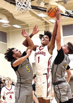 North Rock Creek's Memphis Burdine gets fouled going up for the shot in the game against Tecumseh. NRC won the match-up 78-52. Photo provided by Gowin Photography