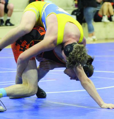 Bethel’s Ryan Clawson tries to hold his own with Lexington’s Tristan Buchanan in the 150-pound class of the Bethel High School Dual on Jan. 9.