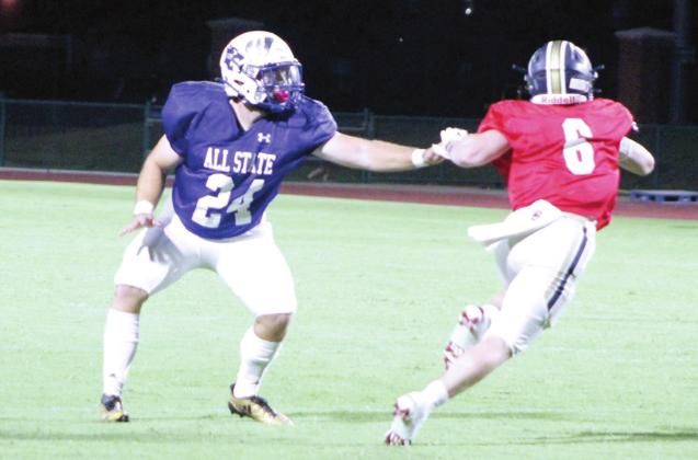 Bethel graduate and linebacker Corey Metscher tries to slow a player on the West Team during the All-State Football game on July 29 at OBU’s Crain Family Stadium. Countywide &amp;amp; Sun/Natasha Dunagan