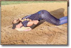 Brooklyn Duff follows tradition and kisses home plate after her last home Fast Pitch game as a Lady Wildcat.