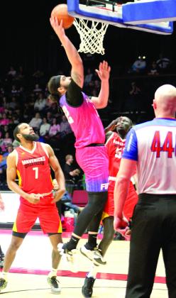 The Potawatomi Fire’s Lyle Hexom sinks one in the bucket during the Pink Out for Cancer and “Shawnee Strong” for disaster relief game. Hexom had 12 points in the game.