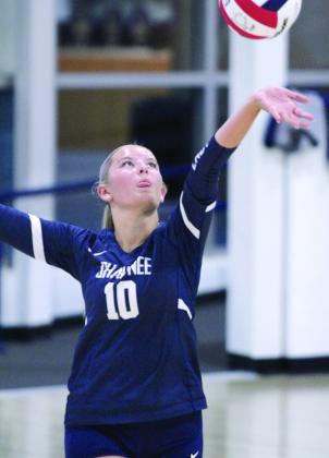 Shawnee’s Harlee Bullard serves at the home match with El Reno on Aug. 22.
