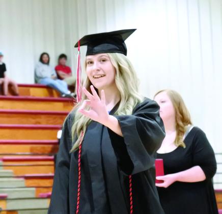 Natalie Haynes, Class Secretary, gives us a sign (and sigh) of relief after receiving her diploma. Suzie Campbell, Countywide &amp;amp; Sun