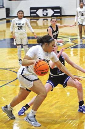Shawnee's Anneca Anderson dribbles around a Noble player on Feb. 18.
