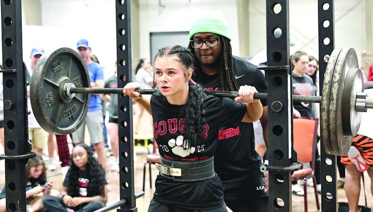 North Rock Creek's Elektra Coughran placed first in squats and third in deadlift for a 270 pound personal best. Coughran placed third in the high school 121-weight class with a total weight of 655 pounds. The Lady Cougars powerlifting team competed in the Oklahoma State Championship. NRC had four lifters medal, and one set a state record. This is the first year for two of the girls to compete. Photo courtesy of Gowin Photography